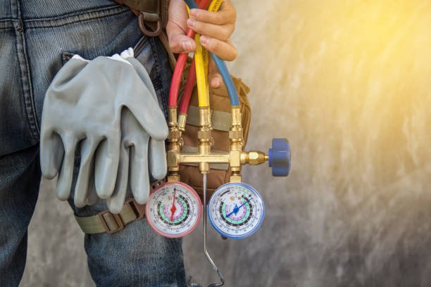 Air Conditioning Technician preparing for the installation of a new air conditioner, showcasing expertise in thermostat repair services in Coral Springs.